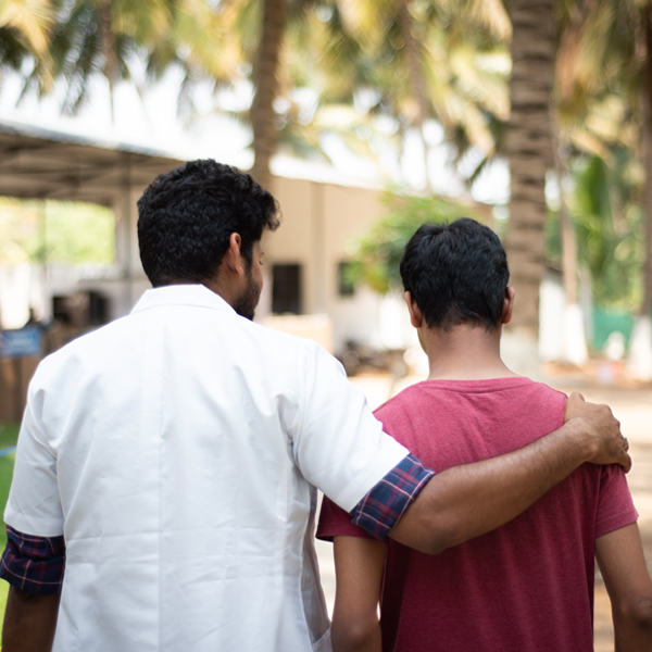 Counselor offering expert addiction support to a patient during a walk at Naveen Rehab Center in Coimbatore.